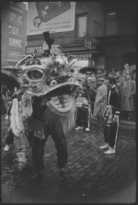 The Dragon dancing in front of a store. Chinatown. Black/white image